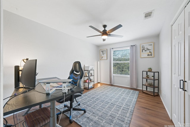 office area with dark hardwood / wood-style flooring and ceiling fan