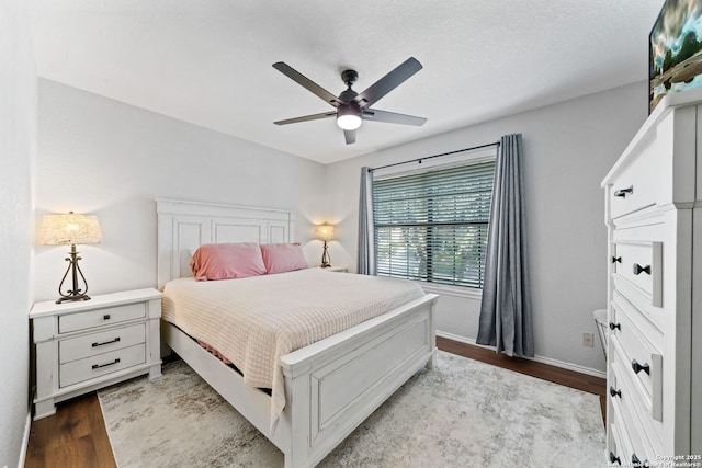 bedroom with ceiling fan and light hardwood / wood-style flooring