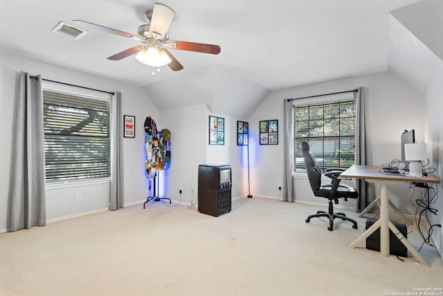 carpeted office with vaulted ceiling, a wealth of natural light, and ceiling fan