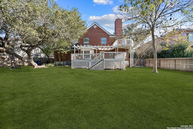 view of yard with a wooden deck and a pergola