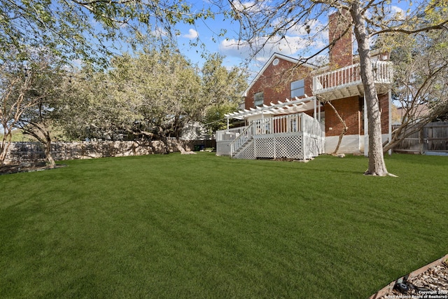 view of yard featuring a pergola and a deck