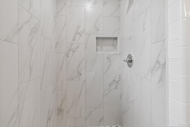 details featuring a tile shower