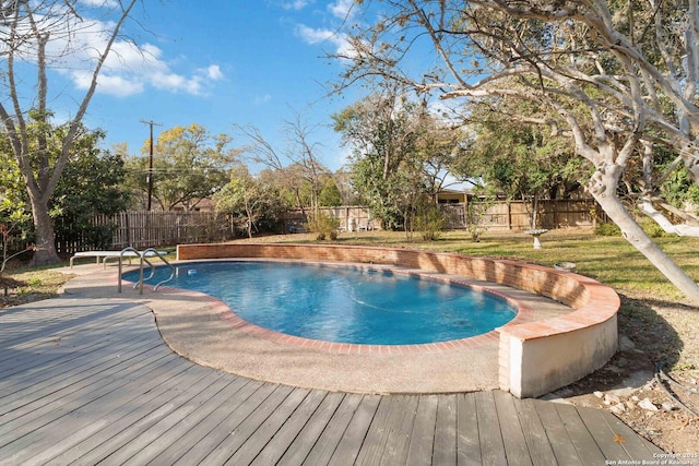 view of swimming pool featuring a deck