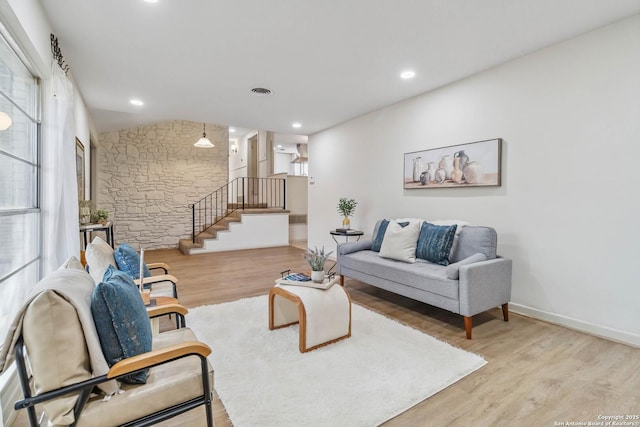 living room with light hardwood / wood-style flooring