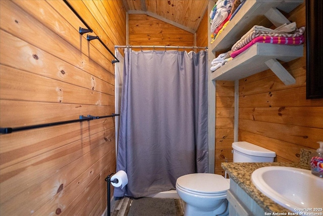 bathroom with vanity, vaulted ceiling, wooden ceiling, toilet, and wood walls