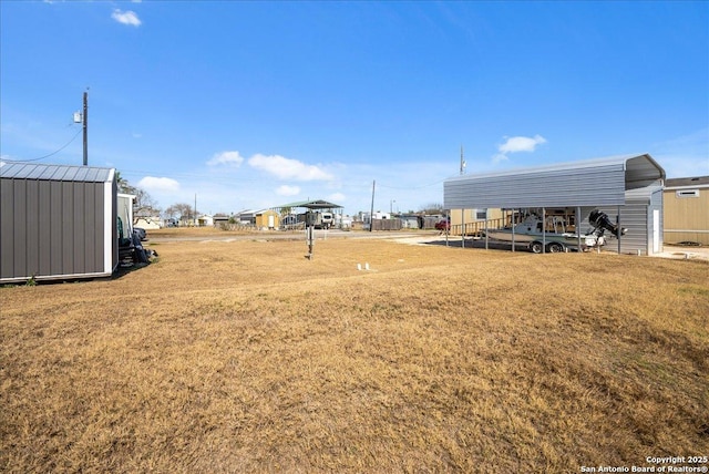 view of yard with a carport