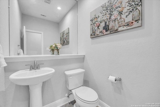 bathroom featuring sink and toilet