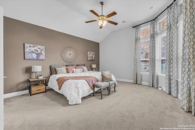 bedroom featuring lofted ceiling, light colored carpet, and ceiling fan