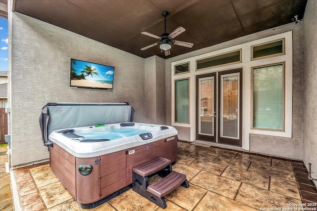 view of patio featuring a hot tub and ceiling fan