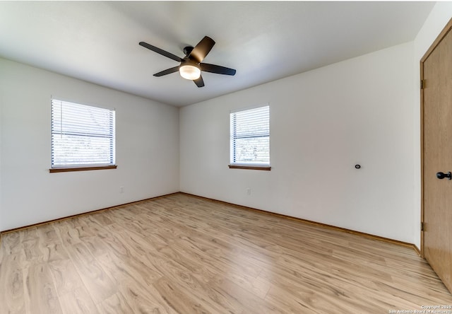 unfurnished room with light wood-style floors and ceiling fan