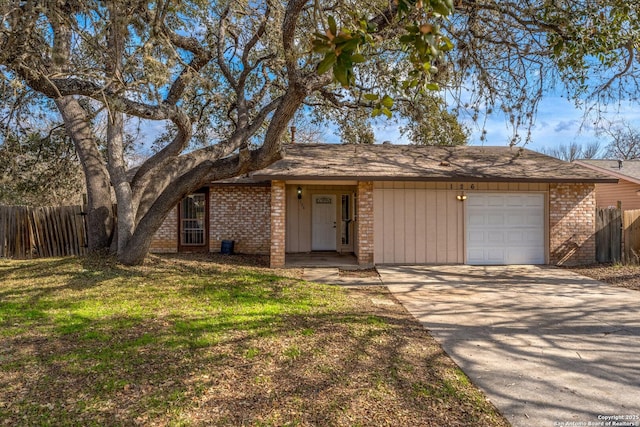 ranch-style home featuring a garage and a front yard