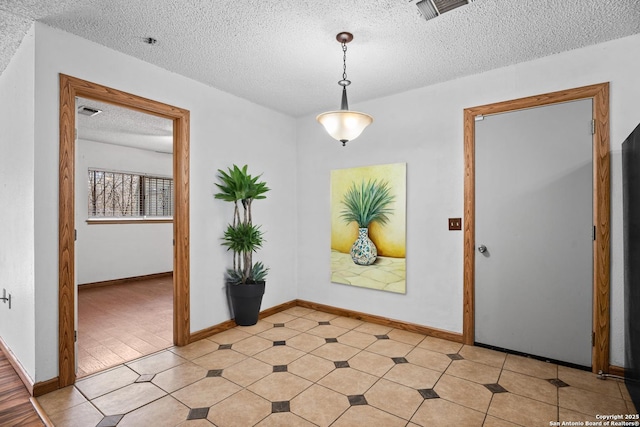 foyer featuring a textured ceiling