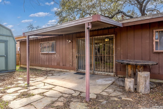 view of patio featuring a storage unit