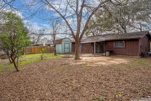 rear view of house with a shed