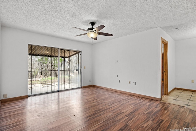 spare room with a textured ceiling, wood-type flooring, and ceiling fan