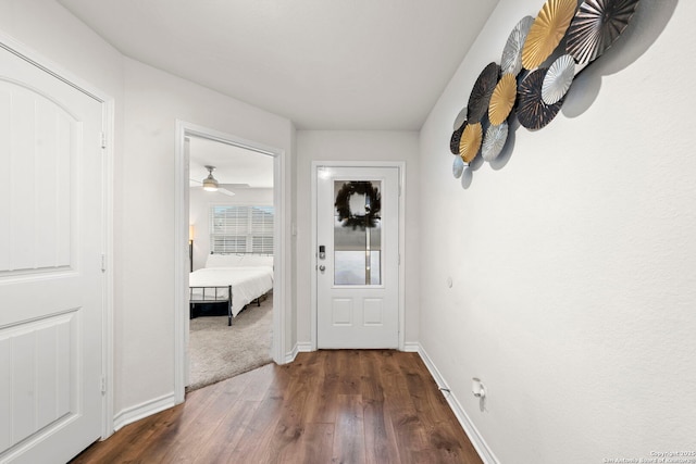 hallway with dark wood-type flooring