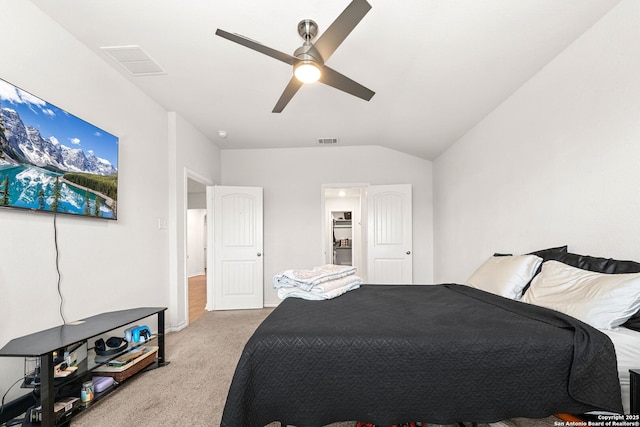 bedroom featuring ceiling fan, vaulted ceiling, and light carpet