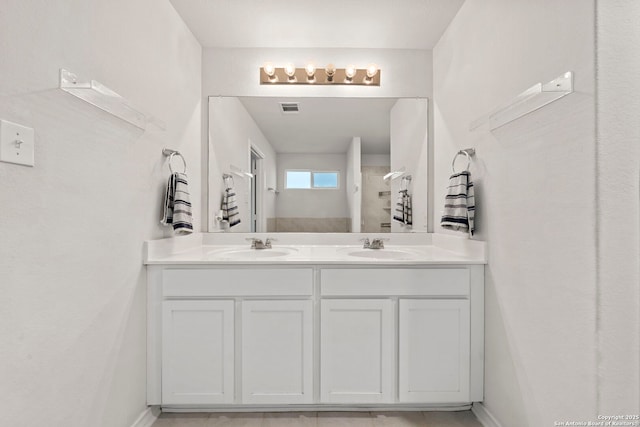 bathroom featuring vanity and walk in shower