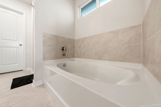 bathroom featuring a tub to relax in and tile patterned floors