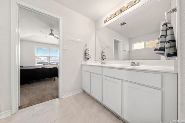 bathroom with vanity, tile patterned flooring, a wealth of natural light, and ceiling fan