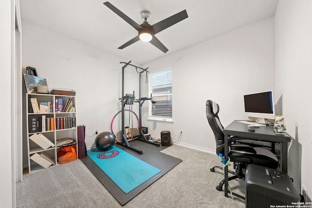 home office with ceiling fan and carpet flooring