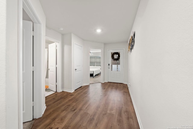 hallway featuring dark hardwood / wood-style floors