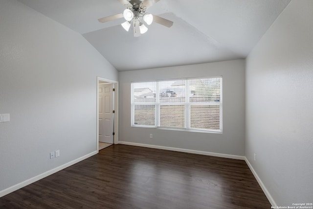 unfurnished room featuring baseboards, dark wood-type flooring, ceiling fan, and vaulted ceiling