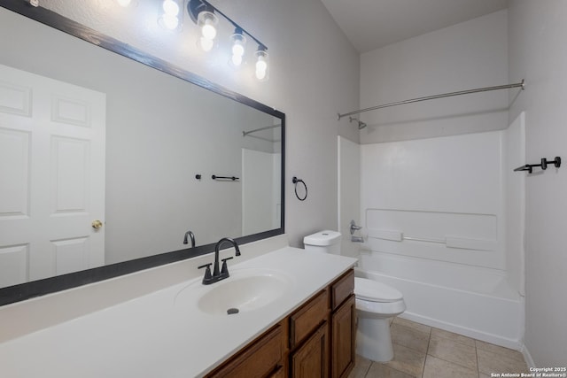 bathroom featuring tile patterned flooring, toilet, vanity, and  shower combination