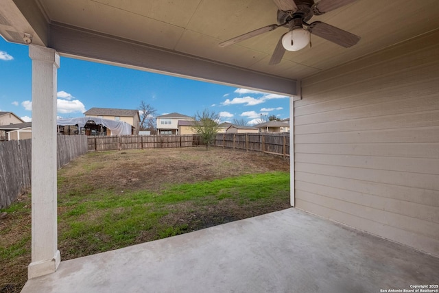 exterior space featuring a fenced backyard, a ceiling fan, and a patio