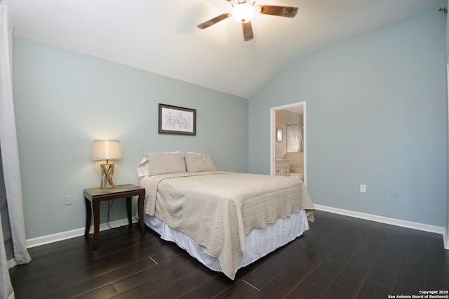 bedroom featuring ceiling fan, lofted ceiling, dark hardwood / wood-style floors, and ensuite bath