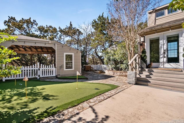 view of yard featuring a patio area and french doors