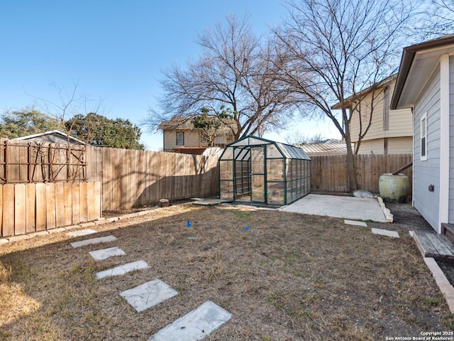 view of yard featuring an outdoor structure and a patio area