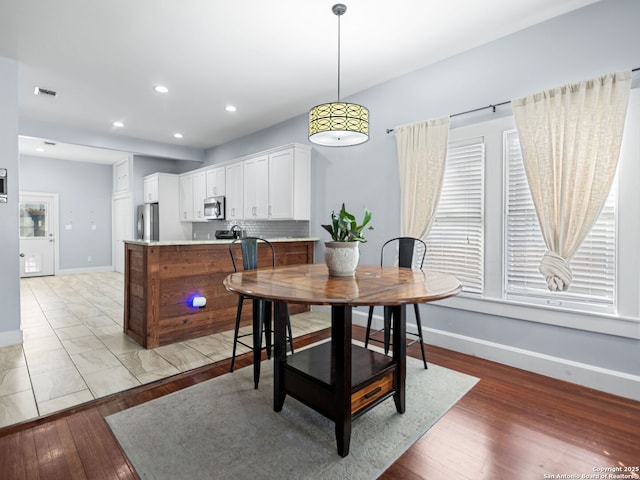 dining room featuring light wood-type flooring