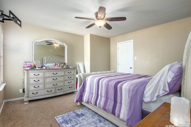 bedroom featuring carpet, a textured ceiling, and ceiling fan