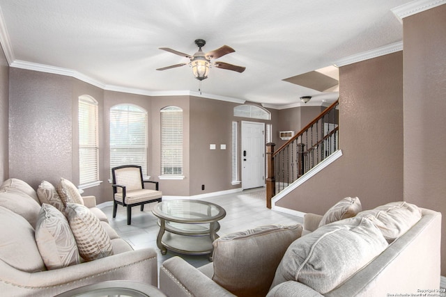 living room featuring crown molding and ceiling fan