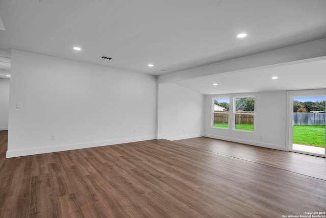 empty room with hardwood / wood-style flooring