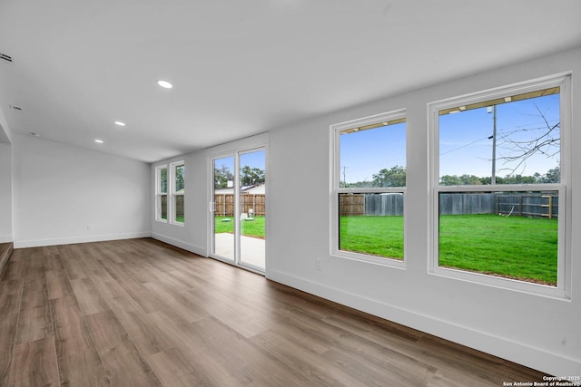 spare room featuring light hardwood / wood-style flooring