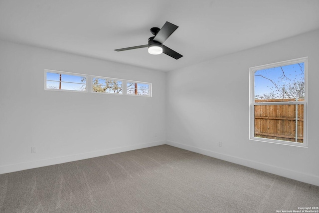 unfurnished room with ceiling fan and carpet flooring