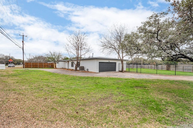 view of side of home featuring a garage, cooling unit, and a lawn