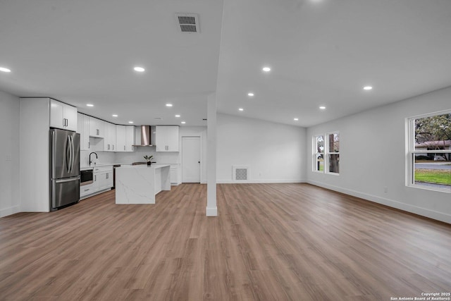 unfurnished living room with light wood-type flooring