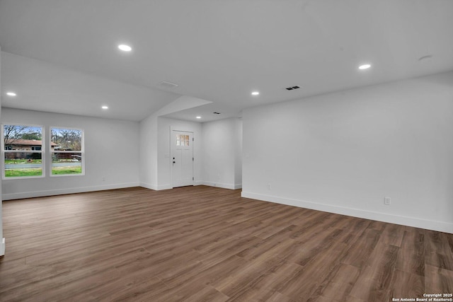 unfurnished living room featuring hardwood / wood-style floors