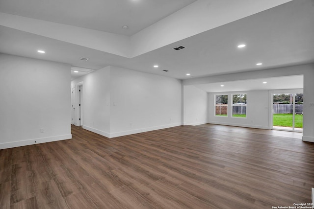 spare room with dark hardwood / wood-style flooring