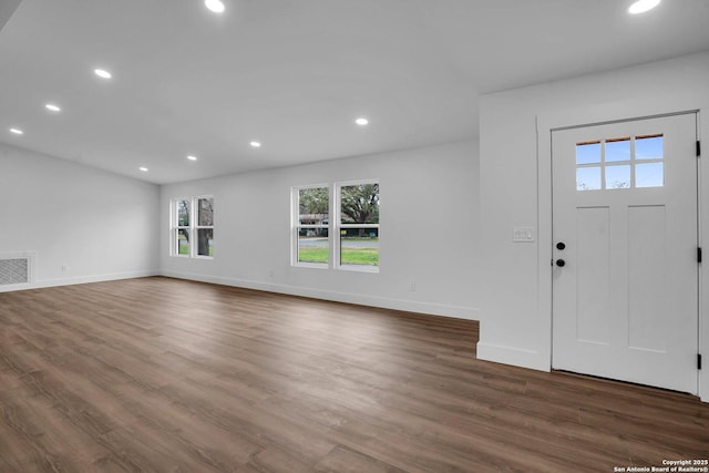 foyer with dark hardwood / wood-style flooring