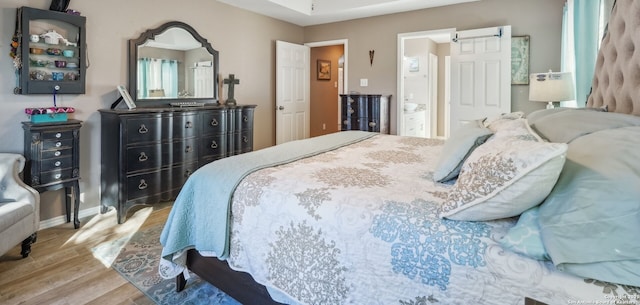 bedroom featuring hardwood / wood-style flooring