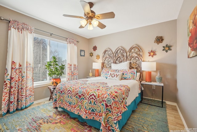 bedroom featuring wood-type flooring and ceiling fan