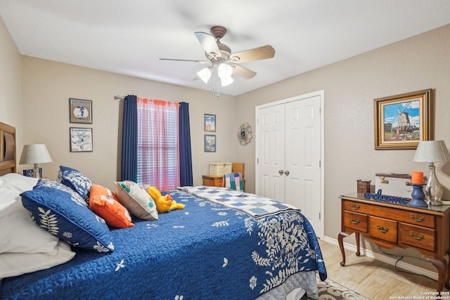 bedroom with a closet, ceiling fan, and light hardwood / wood-style flooring