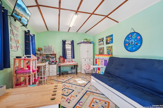 rec room featuring vaulted ceiling and hardwood / wood-style floors