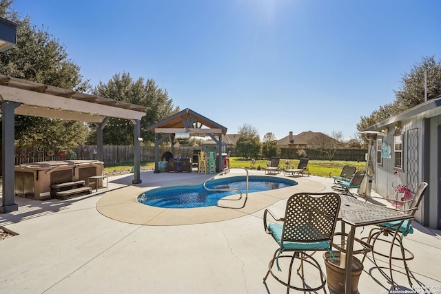 view of pool with a gazebo, a hot tub, and a patio