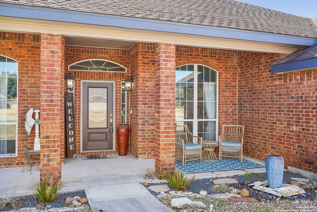 entrance to property featuring a porch