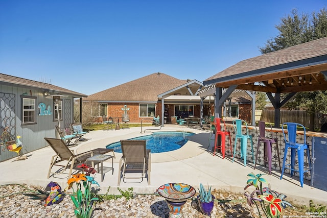 view of swimming pool featuring a gazebo and a patio